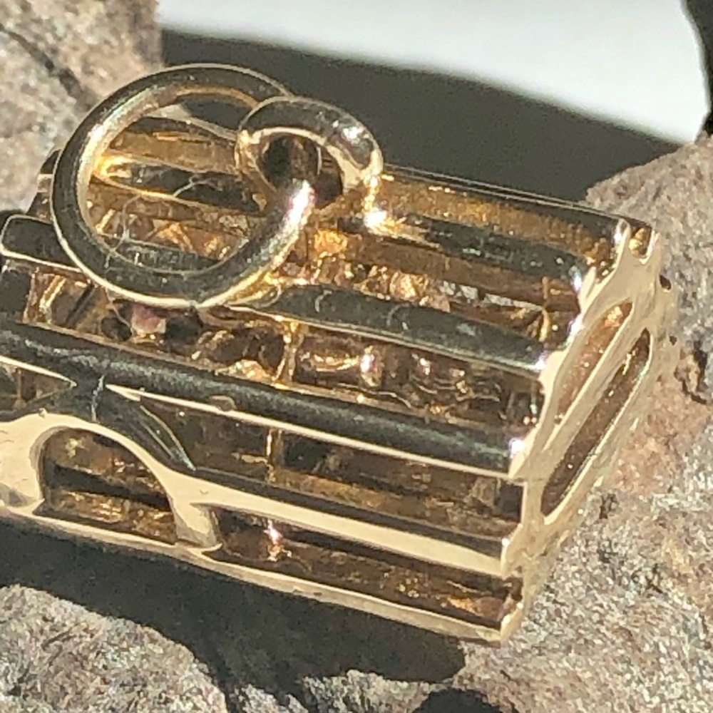 14 karat yellow gold lobster trap charm.